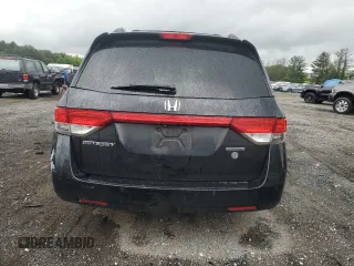 2014 Honda Odyssey Touring with VIN 5FNRL5H95EB056118, listed as a Copart auction lot 57729865 with Not provided miles and Salvage title. Bid and sale history available at DreamBid. Image 6.