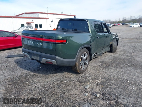 2022 Rivian R1T Adventure z VIN 7FCTGAAA8NN015369, wystawiony jako IAAI lot #41407842 z przebiegiem 22 507 mil mil oraz . Historia ofert i sprzedaży dostępna na DreamBid. Obrazek 4.