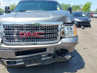 2013 GMC Sierra 2500HD Denali with VIN 1GT125E80DF154320, listed as a IAAI auction lot 42264742 with 171,013 mi miles and . Bid and sale history available at DreamBid. Image 6.
