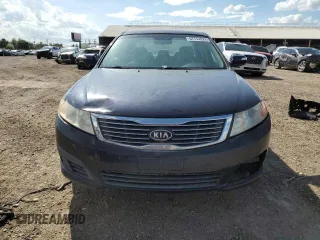2010 Kia Optima LX z VIN KNAGG4A86A5426444, wystawiony jako Copart lot #61498275 z przebiegiem 166 526 mil mil oraz Czysty tytuł • Clean title. Historia ofert i sprzedaży dostępna na DreamBid. Obrazek 5.