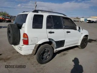 2002 Suzuki Grand Vitara JLX z VIN JS3TD62V824154031, wystawiony jako Copart lot #76403684 z przebiegiem 208 529 mil mil oraz Szkoda całkowita • Salvage title. Historia ofert i sprzedaży dostępna na DreamBid. Obrazek 3.