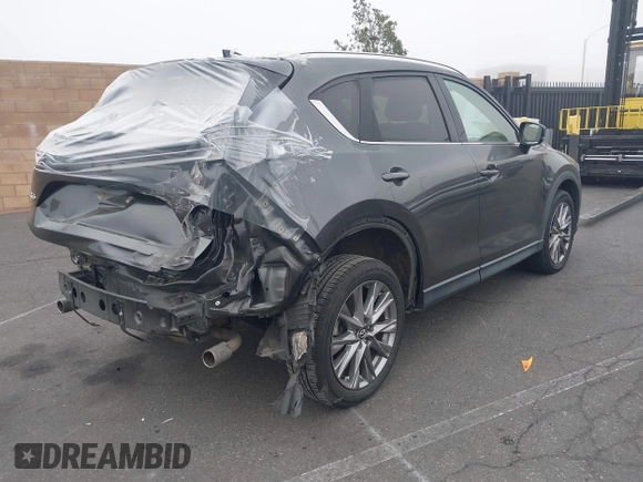 2021 Mazda CX-5 Grand Touring with VIN JM3KFADM2M1340669, listed as a IAAI auction lot 41916687 with 83,872 mi miles. Bid and sale history available at carsss.com. Image 4.