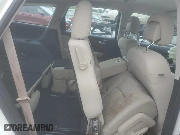 2013 Dodge Journey American Value with VIN 3C4PDCAB3DT516477, listed as a Copart auction lot 56129035 with 181,077 mi miles and Salvage title. Bid and sale history available at DreamBid. Image 11.