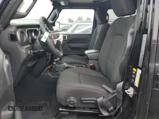 2023 Jeep Wrangler Sport with VIN 1C4HJXDNXPW701795, listed as a Copart auction lot 50451444 with 7,274 mi miles and Salvage Title. Bid and sale history available at DreamBid. Image 7.