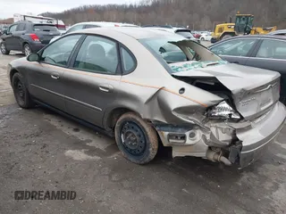 2005 Ford Taurus SE with VIN 1FAFP53215A127489, listed as a IAAI auction lot 40940239 with 127,180 mi miles. Bid and sale history available at carsss.com. Image 3.