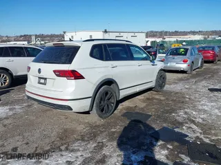 2023 Volkswagen Tiguan SE R-Line Black with VIN 3VVCB7AX8PM141998, listed as a IAAI auction lot 41278010 with 230,000 mi miles. Bid and sale history available at carsss.com. Image 4.