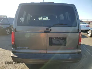 1999 GMC Safari with VIN 1GKEL19W9XB530660, listed as a Copart auction lot 79109684 with 161,240 mi miles and Salvage Title. Bid and sale history available at carsss.com. Image 6.