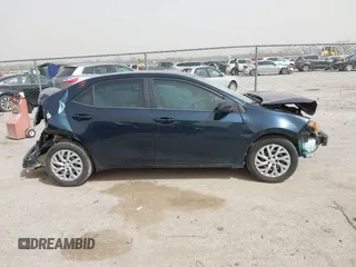 2018 Toyota Corolla L z VIN 5YFBURHE6JP840504, wystawiony jako IAAI lot #41790115 z przebiegiem 83 026 mil mil oraz . Historia ofert i sprzedaży dostępna na DreamBid. Obrazek 12.