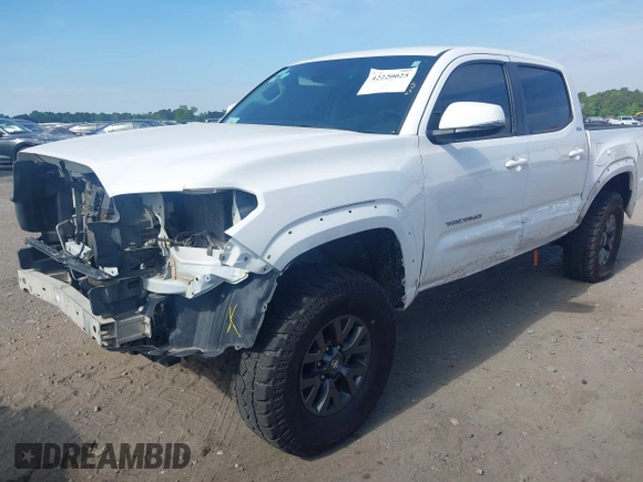 2023 Toyota Tacoma SR with VIN 3TYCZ5AN2PT112854, listed as a IAAI auction lot 42220025 with 43,657 mi miles and . Bid and sale history available at DreamBid. Image 6.