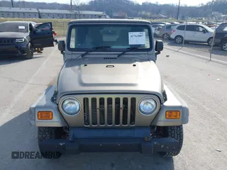 2006 Jeep Wrangler Sport Right Hand Drive with VIN 1J4F449S46P716520, listed as a IAAI auction lot 41763887 with 236,816 mi miles. Bid and sale history available at carsss.com. Image 12.