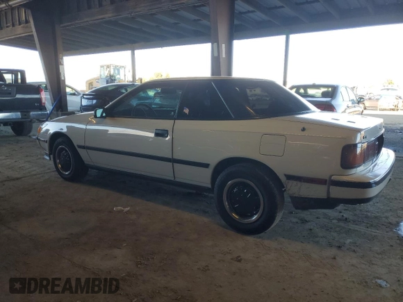 1986 Toyota Celica z VIN JT2ST64CXG7013064, wystawiony jako Copart lot #44228575 z przebiegiem 101 881 mil mil oraz Szkoda całkowita • Salvage title. Historia ofert i sprzedaży dostępna na DreamBid. Obrazek 2.