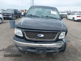 2002 Ford F-150 XLT with VIN 1FTRW08L32KD90202, listed as a IAAI auction lot 41850546 with 256,807 mi miles. Bid and sale history available at carsss.com. Image 6.