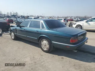 1996 Jaguar XJ z VIN SAJHX1746TC756451, wystawiony jako Copart lot #48991655 z przebiegiem 115 015 mil mil oraz Szkoda całkowita • Salvage title. Historia ofert i sprzedaży dostępna na DreamBid. Obrazek 2.