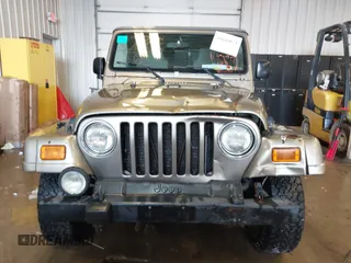 2003 Jeep Wrangler Sahara z VIN 1J4FA59S83P343234, wystawiony jako IAAI lot #41644074 z przebiegiem 197 461 mil mil oraz . Historia ofert i sprzedaży dostępna na DreamBid. Obrazek 12.