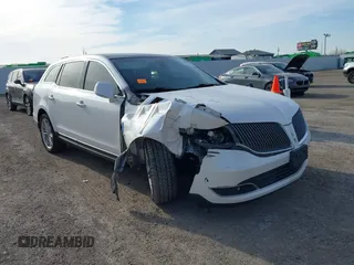 2014 Lincoln MKT EcoBoost with VIN 2LMHJ5AT2EBL57269, listed as a IAAI auction lot 41440818 with 135,896 mi miles and . Bid and sale history available at DreamBid. Image 1.