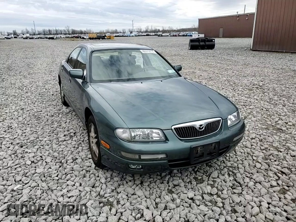 2000 Mazda Millenia z VIN JM1TA2212Y1610919, wystawiony jako Copart lot #80375014 z przebiegiem 127 938 mil mil oraz Szkoda całkowita • Salvage title. Historia ofert i sprzedaży dostępna na DreamBid. Obrazek 10.