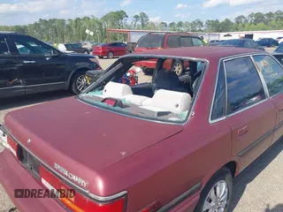 1991 Toyota Camry DLX z VIN 4T1SV21E0MU347371, wystawiony jako IAAI lot #42048695 z przebiegiem 209 451 mil mil oraz . Historia ofert i sprzedaży dostępna na DreamBid. Obrazek 12.