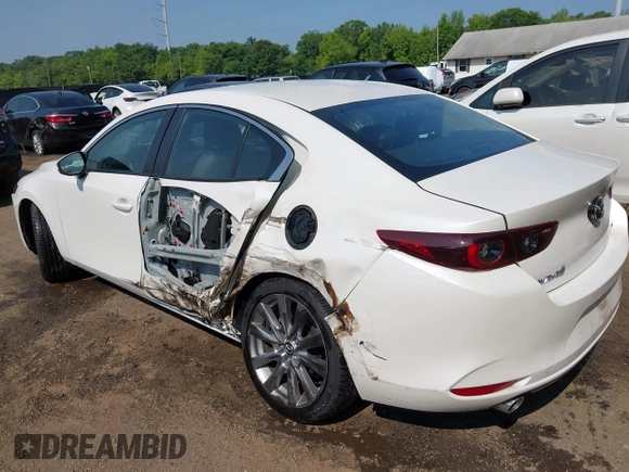 2022 Mazda 3 Carbon Edition with VIN 3MZBPACL0NM318573, listed as a IAAI auction lot 42403393 with 8,762 mi miles and . Bid and sale history available at DreamBid. Image 3.