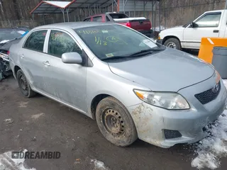 2009 Toyota Corolla with VIN 1NXBU40E19Z009548, listed as a IAAI auction lot 41310085 with 122,944 mi miles. Bid and sale history available at carsss.com. Image 1.