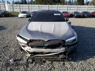 2018 BMW M5 z VIN WBSJF0C56JB282086, wystawiony jako Copart lot #37483454 z przebiegiem Nie podano mil oraz Szkoda całkowita • Salvage title. Historia ofert i sprzedaży dostępna na DreamBid. Obrazek 5.