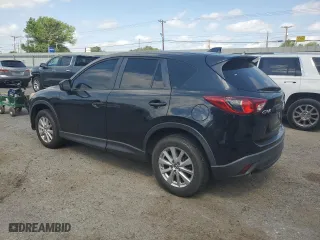2014 Mazda CX-5 Touring with VIN JM3KE2CY7E0427312, listed as a Copart auction lot 52869335 with 192,903 mi miles and Salvage Title. Bid and sale history available at carsss.com. Image 2.