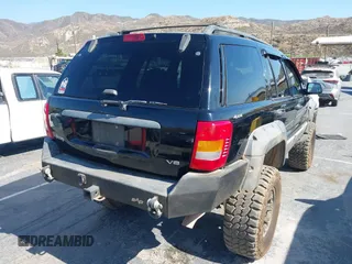 2000 Jeep Grand Cherokee Laredo with VIN 1J4GW48N0YC204645, listed as a IAAI auction lot 42650659 with 217,851 mi miles and . Bid and sale history available at DreamBid. Image 4.