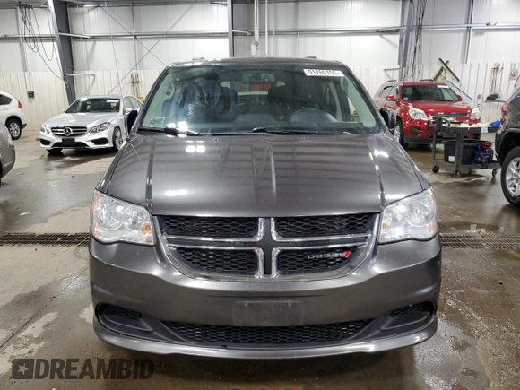 2015 Dodge Grand Caravan SXT with VIN 2C4RDGCG5FR622086, listed as a Copart auction lot 51769155 with 217,538 mi miles and Salvage Title. Bid and sale history available at DreamBid. Image 5.