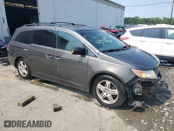 2013 Honda Odyssey Touring with VIN 5FNRL5H93DB017932, listed as a Copart auction lot 60112165 with 110,761 mi miles and Salvage title. Bid and sale history available at DreamBid. Image 4.