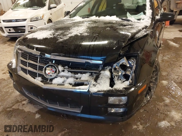 2010 Cadillac STS AWD with VIN 1G6DU6EV2A0125065, listed as a IAAI auction lot 41229886 with 84,954 mi miles and . Bid and sale history available at DreamBid. Image 6.