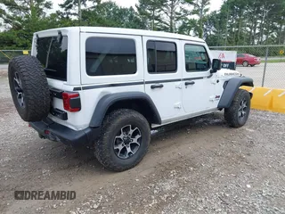 2021 Jeep Wrangler Unlimited Rubicon with VIN 1C4JJXFM9MW774142, listed as a IAAI auction lot 42625007 with 42,318 mi miles and . Bid and sale history available at DreamBid. Image 4.