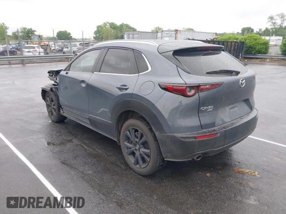 2023 Mazda CX-30 S Carbon Edition with VIN 3MVDMBCM9PM574358, listed as a IAAI auction lot 42105931 with 55,975 mi miles and . Bid and sale history available at DreamBid. Image 3.