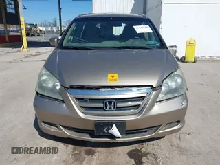 2006 Honda Odyssey EX z VIN 5FNRL384X6B459148, wystawiony jako IAAI lot #41747616 z przebiegiem 158 995 mil mil oraz . Historia ofert i sprzedaży dostępna na DreamBid. Obrazek 6.