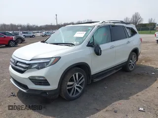 2016 Honda Pilot Touring with VIN 5FNYF6H90GB102403, listed as a IAAI auction lot 42007825 with 69,450 mi miles. Bid and sale history available at carsss.com. Image 2.