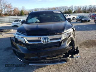 2021 Honda Pilot Touring 8-Passenger with VIN 5FNYF5H94MB039974, listed as a Copart auction lot 82654964 with 54,048 mi miles and Salvage Title. Bid and sale history available at DreamBid. Image 5.
