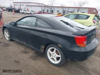 2000 Toyota Celica GT with VIN JTDDR32T7Y0006809, listed as a IAAI auction lot 41860933 with 262,014 mi miles. Bid and sale history available at carsss.com. Image 3.