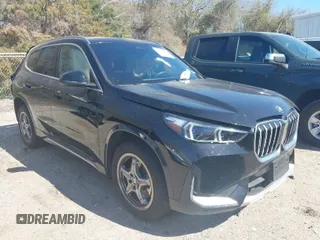 2025 BMW X1 xDrive28i with VIN WBX73EF05S5097084, listed as a IAAI auction lot 41835592 with 9,082 mi miles. Bid and sale history available at carsss.com. Image 1.