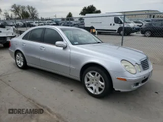 2003 Mercedes-Benz E-Class 5.0L with VIN WDBUF70J03A112909, listed as a Copart auction lot 49924865 with 158,244 mi miles and Salvage Title. Bid and sale history available at carsss.com. Image 4.
