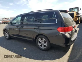 2010 Honda Odyssey Touring with VIN 5FNRL3H9XAB067890, listed as a Copart auction lot 63520575 with 213,582 mi miles and Clean title. Bid and sale history available at DreamBid. Image 2.