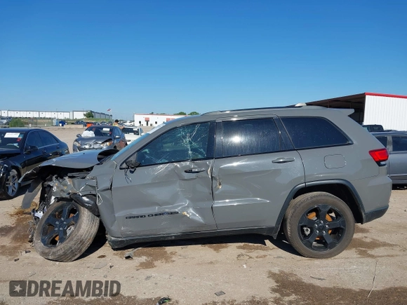 2019 Jeep Grand Cherokee Laredo E with VIN 1C4RJFAG2KC611457, listed as a IAAI auction lot 42212982 with 97,603 mi miles and . Bid and sale history available at DreamBid. Image 14.