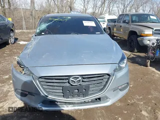 2018 Mazda 3 Touring z VIN 3MZBN1V36JM205904, wystawiony jako IAAI lot #41586707 z przebiegiem 145 401 mil mil oraz . Historia ofert i sprzedaży dostępna na DreamBid. Obrazek 11.