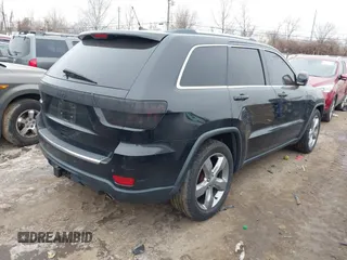 2013 Jeep Grand Cherokee Overland with VIN 1C4RJFCG1DC593890, listed as a IAAI auction lot 41264434 with 204,324 mi miles. Bid and sale history available at carsss.com. Image 4.