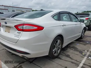 2016 Ford Fusion Titanium Hybrid with VIN 3FA6P0RU3GR190355, listed as a IAAI auction lot 42384309 with 157,172 mi miles and . Bid and sale history available at DreamBid. Image 4.