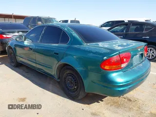 1999 Oldsmobile Alero GL z VIN 1G3NL52T0XC354966, wystawiony jako IAAI lot #42259258 z przebiegiem Nie podano mil oraz . Historia ofert i sprzedaży dostępna na DreamBid. Obrazek 3.