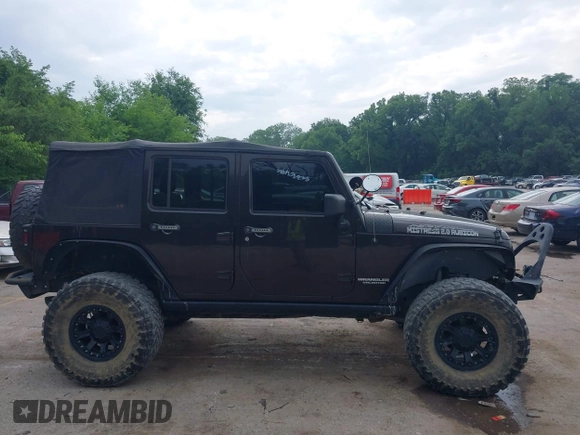 2013 Jeep Wrangler Unlimited Rubicon with VIN 1C4BJWFG5DL652050, listed as a IAAI auction lot 42451954 with 107,110 mi miles and . Bid and sale history available at DreamBid. Image 13.