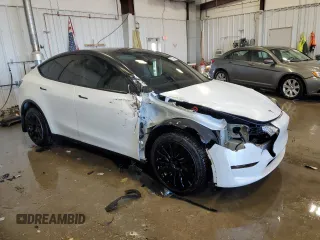 2023 Tesla Model Y Long Range z VIN 7SAYGAEE5PF672546, wystawiony jako Copart lot #42779065 z przebiegiem 27 570 mil mil oraz Nie do naprawy • Non repairable. Historia ofert i sprzedaży dostępna na DreamBid. Obrazek 4.