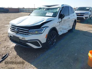 2022 Volkswagen Tiguan SE with VIN 3VV2B7AX2NM010932, listed as a IAAI auction lot 42007364 with 26,014 mi miles and . Bid and sale history available at DreamBid. Image 2.