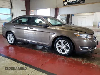 2015 Ford Taurus SEL with VIN 1FAHP2E94FG157022, listed as a Copart auction lot 74569614 with 133,223 mi miles and Salvage Title. Bid and sale history available at DreamBid. Image 4.