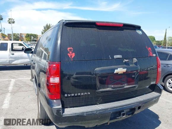 2011 Chevrolet Suburban LT with VIN 1GNSCJE0XBR285973, listed as a IAAI auction lot 42007844 with 252,994 mi miles. Bid and sale history available at carsss.com. Image 3.