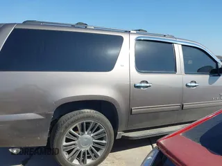 2011 Chevrolet Suburban LT with VIN 1GNSCJE03BR381301, listed as a IAAI auction lot 41412636 with 243,601 mi miles. Bid and sale history available at carsss.com. Image 13.