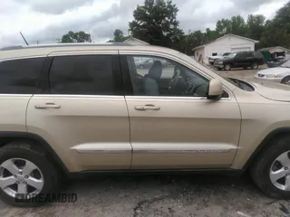 2012 Jeep Grand Cherokee Laredo with VIN 1C4RJEAGXCC157616, listed as a IAAI auction lot 42156539 with 301,661 mi miles. Bid and sale history available at carsss.com. Image 13.